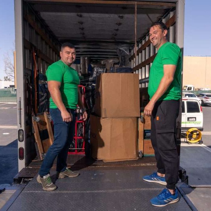 our team crew loading boxes into the truck